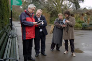 Eugene and Simon show Andrew and Mel the typo that slipped through to print.