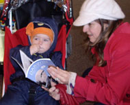 Julia Gurr attempts to interest son Joseph in Simon's book.