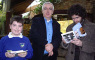 Jamie gets his copy of Darwin: a graphic biography signed by Eugene and Simon on launch day.